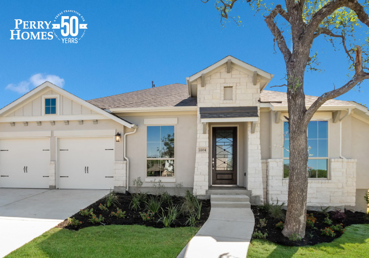 beige one story stucco home with white accent stone, attached two car garage and brown wood glass front door